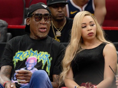 Dennis Rodman and his current girlfriend, Yella Yella, spotted together.